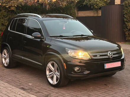 Чорний Фольксваген Тігуан, об'ємом двигуна 2 л та пробігом 207 тис. км за 14200 $, фото 1 на Automoto.ua