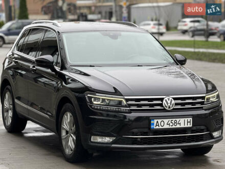 Чорний Фольксваген Тігуан, об'ємом двигуна 2 л та пробігом 209 тис. км за 23800 $, фото 1 на Automoto.ua