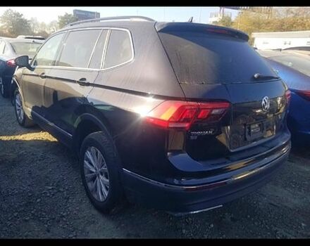 Черный Фольксваген Тигуан, объемом двигателя 2 л и пробегом 100 тыс. км за 9000 $, фото 1 на Automoto.ua