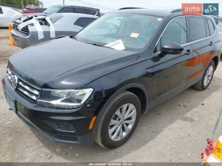 Черный Фольксваген Тигуан, объемом двигателя 2 л и пробегом 187 тыс. км за 16000 $, фото 1 на Automoto.ua