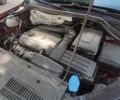 Красный Фольксваген Тигуан, объемом двигателя 2 л и пробегом 263 тыс. км за 9600 $, фото 1 на Automoto.ua