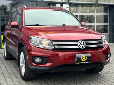 Червоний Фольксваген Тігуан, об'ємом двигуна 2 л та пробігом 175 тис. км за 13800 $, фото 1 на Automoto.ua