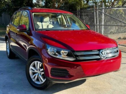 Червоний Фольксваген Тігуан, об'ємом двигуна 2 л та пробігом 76 тис. км за 2400 $, фото 1 на Automoto.ua