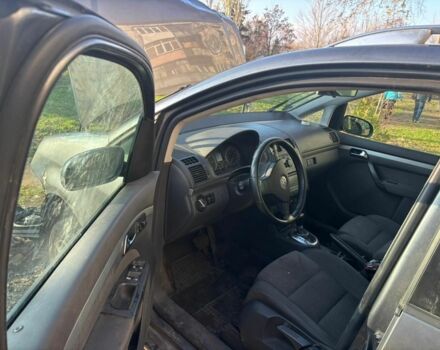 Серый Фольксваген Тигуан, объемом двигателя 2 л и пробегом 140 тыс. км за 1425 $, фото 1 на Automoto.ua