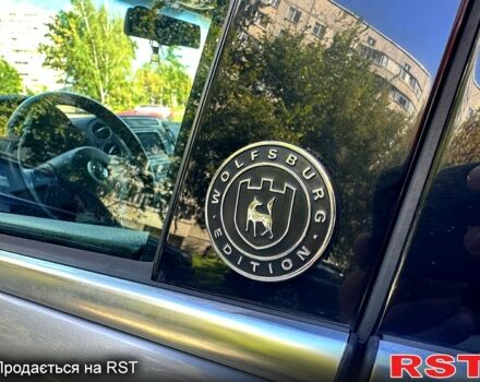 Сірий Фольксваген Тігуан, об'ємом двигуна 2 л та пробігом 190 тис. км за 13700 $, фото 4 на Automoto.ua