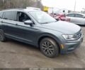 Серый Фольксваген Тигуан, объемом двигателя 2 л и пробегом 59 тыс. км за 4000 $, фото 1 на Automoto.ua