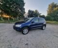 Синий Фольксваген Тигуан, объемом двигателя 2 л и пробегом 300 тыс. км за 9500 $, фото 1 на Automoto.ua