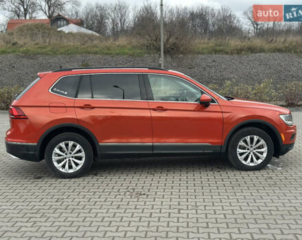 Оранжевый Фольксваген Тигуан, объемом двигателя 2 л и пробегом 143 тыс. км за 16700 $, фото 2 на Automoto.ua