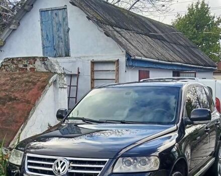 Черный Фольксваген Туарег, объемом двигателя 5 л и пробегом 315 тыс. км за 8500 $, фото 1 на Automoto.ua