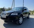 Черный Фольксваген Туарег, объемом двигателя 3 л и пробегом 270 тыс. км за 9990 $, фото 1 на Automoto.ua