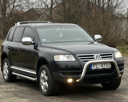 Черный Фольксваген Туарег, объемом двигателя 3 л и пробегом 325 тыс. км за 5900 $, фото 1 на Automoto.ua