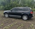 Черный Фольксваген Туарег, объемом двигателя 3.2 л и пробегом 290 тыс. км за 7700 $, фото 1 на Automoto.ua