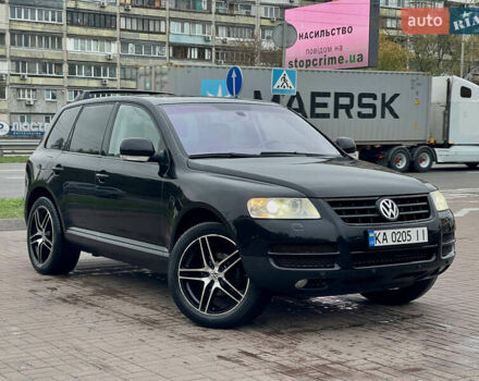 Черный Фольксваген Туарег, объемом двигателя 2.46 л и пробегом 249 тыс. км за 7800 $, фото 1 на Automoto.ua