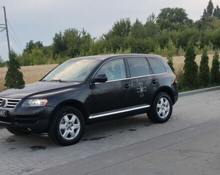 Черный Фольксваген Туарег, объемом двигателя 5 л и пробегом 300 тыс. км за 3000 $, фото 1 на Automoto.ua