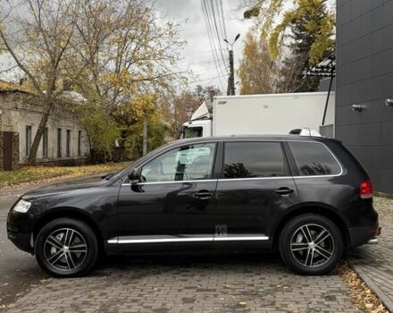 Чорний Фольксваген Туарег, об'ємом двигуна 5 л та пробігом 300 тис. км за 4700 $, фото 6 на Automoto.ua