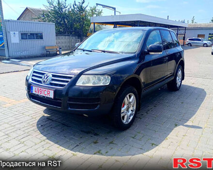 Черный Фольксваген Туарег, объемом двигателя 3.2 л и пробегом 318 тыс. км за 4950 $, фото 1 на Automoto.ua