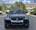 Чорний Фольксваген Туарег, об'ємом двигуна 3 л та пробігом 251 тис. км за 10699 $, фото 1 на Automoto.ua