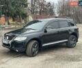 Черный Фольксваген Туарег, объемом двигателя 3 л и пробегом 240 тыс. км за 10500 $, фото 1 на Automoto.ua