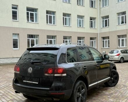 Чорний Фольксваген Туарег, об'ємом двигуна 3 л та пробігом 300 тис. км за 6490 $, фото 4 на Automoto.ua