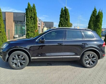 Черный Фольксваген Туарег, объемом двигателя 3 л и пробегом 240 тыс. км за 17500 $, фото 1 на Automoto.ua