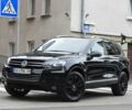 Черный Фольксваген Туарег, объемом двигателя 3 л и пробегом 256 тыс. км за 18900 $, фото 1 на Automoto.ua