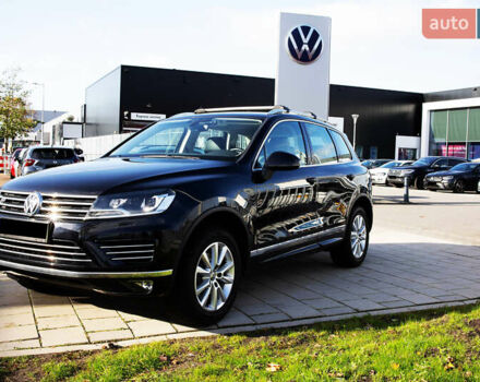 Чорний Фольксваген Туарег, об'ємом двигуна 3 л та пробігом 106 тис. км за 32519 $, фото 1 на Automoto.ua