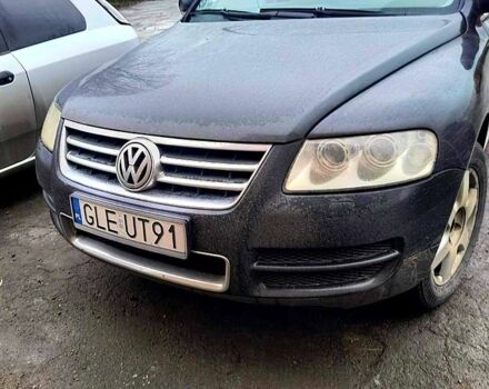 Черный Фольксваген Туарег, объемом двигателя 5 л и пробегом 411 тыс. км за 4300 $, фото 1 на Automoto.ua