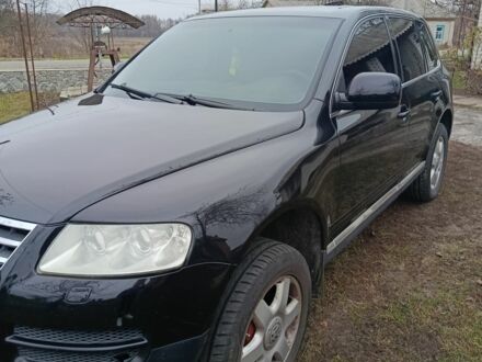 Черный Фольксваген Туарег, объемом двигателя 3.2 л и пробегом 320 тыс. км за 7800 $, фото 1 на Automoto.ua