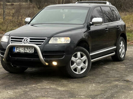 Черный Фольксваген Туарег, объемом двигателя 3 л и пробегом 325 тыс. км за 5900 $, фото 1 на Automoto.ua