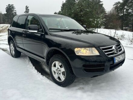 Чорний Фольксваген Туарег, об'ємом двигуна 3 л та пробігом 295 тис. км за 3636 $, фото 1 на Automoto.ua