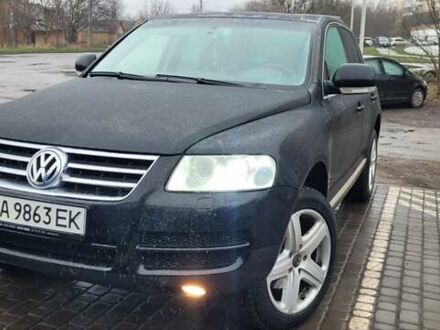 Чорний Фольксваген Туарег, об'ємом двигуна 3 л та пробігом 328 тис. км за 10000 $, фото 1 на Automoto.ua