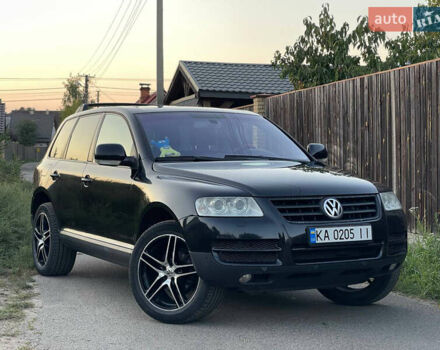 Черный Фольксваген Туарег, объемом двигателя 2.46 л и пробегом 249 тыс. км за 8900 $, фото 1 на Automoto.ua