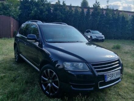 Черный Фольксваген Туарег, объемом двигателя 5 л и пробегом 200 тыс. км за 6500 $, фото 1 на Automoto.ua