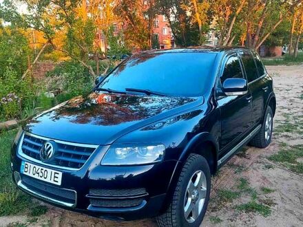 Черный Фольксваген Туарег, объемом двигателя 3.2 л и пробегом 355 тыс. км за 8300 $, фото 1 на Automoto.ua