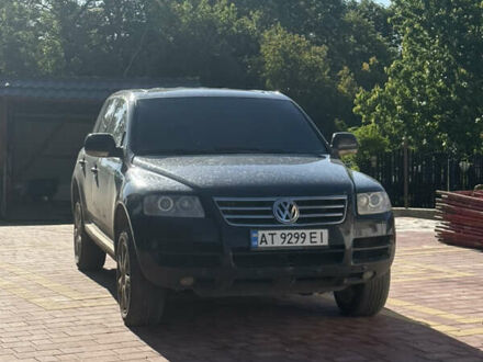 Черный Фольксваген Туарег, объемом двигателя 2.97 л и пробегом 318 тыс. км за 9800 $, фото 1 на Automoto.ua