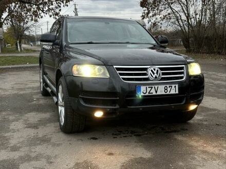 Черный Фольксваген Туарег, объемом двигателя 3 л и пробегом 250 тыс. км за 3350 $, фото 1 на Automoto.ua