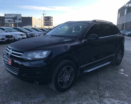 Чорний Фольксваген Туарег, об'ємом двигуна 3 л та пробігом 225 тис. км за 18490 $, фото 1 на Automoto.ua