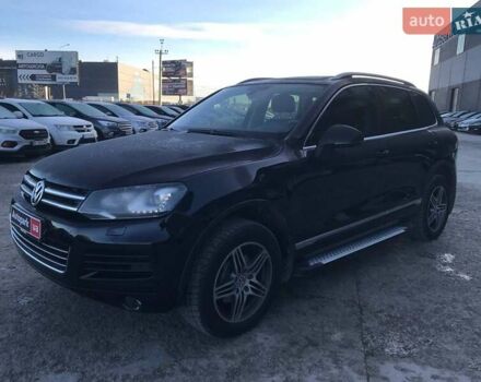 Чорний Фольксваген Туарег, об'ємом двигуна 3 л та пробігом 225 тис. км за 18490 $, фото 1 на Automoto.ua
