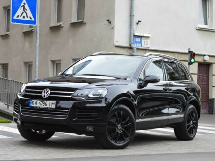 Черный Фольксваген Туарег, объемом двигателя 3 л и пробегом 256 тыс. км за 18900 $, фото 1 на Automoto.ua