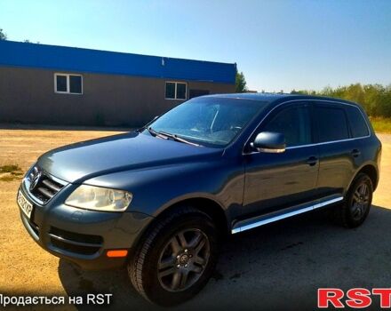 Серый Фольксваген Туарег, объемом двигателя 4.2 л и пробегом 355 тыс. км за 9500 $, фото 2 на Automoto.ua