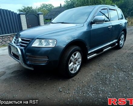 Серый Фольксваген Туарег, объемом двигателя 3.2 л и пробегом 300 тыс. км за 8500 $, фото 2 на Automoto.ua