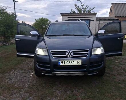 Серый Фольксваген Туарег, объемом двигателя 2.97 л и пробегом 380 тыс. км за 9200 $, фото 1 на Automoto.ua