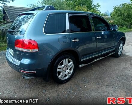 Серый Фольксваген Туарег, объемом двигателя 3.2 л и пробегом 300 тыс. км за 8500 $, фото 1 на Automoto.ua