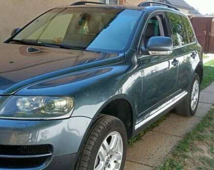 Серый Фольксваген Туарег, объемом двигателя 3 л и пробегом 304 тыс. км за 9300 $, фото 1 на Automoto.ua