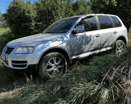 Серый Фольксваген Туарег, объемом двигателя 3 л и пробегом 290 тыс. км за 5800 $, фото 1 на Automoto.ua