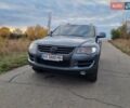 Серый Фольксваген Туарег, объемом двигателя 3 л и пробегом 306 тыс. км за 14800 $, фото 1 на Automoto.ua