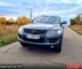 Серый Фольксваген Туарег, объемом двигателя 3 л и пробегом 306 тыс. км за 14800 $, фото 1 на Automoto.ua
