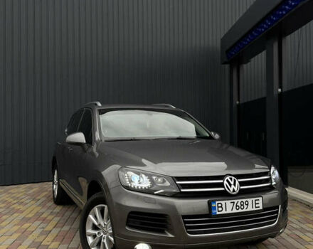 Серый Фольксваген Туарег, объемом двигателя 2.97 л и пробегом 360 тыс. км за 17500 $, фото 1 на Automoto.ua