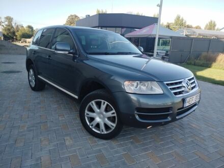 Сірий Фольксваген Туарег, об'ємом двигуна 3 л та пробігом 440 тис. км за 5900 $, фото 1 на Automoto.ua