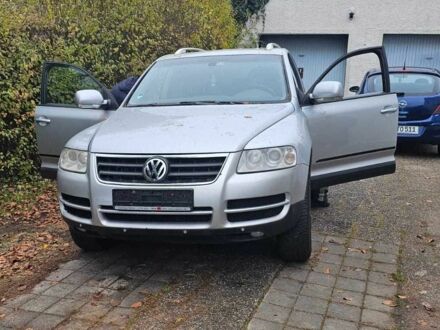 Сірий Фольксваген Туарег, об'ємом двигуна 3 л та пробігом 302 тис. км за 6402 $, фото 1 на Automoto.ua